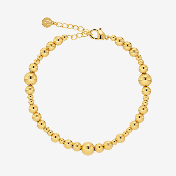 Guldpläterat Sphere-armband med kulor i olika storlekar i blankt rostfritt stål