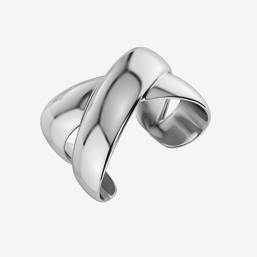 Alexa Bangle armband i blankt rostfritt stål med skulptural X-form som omsluter handleden