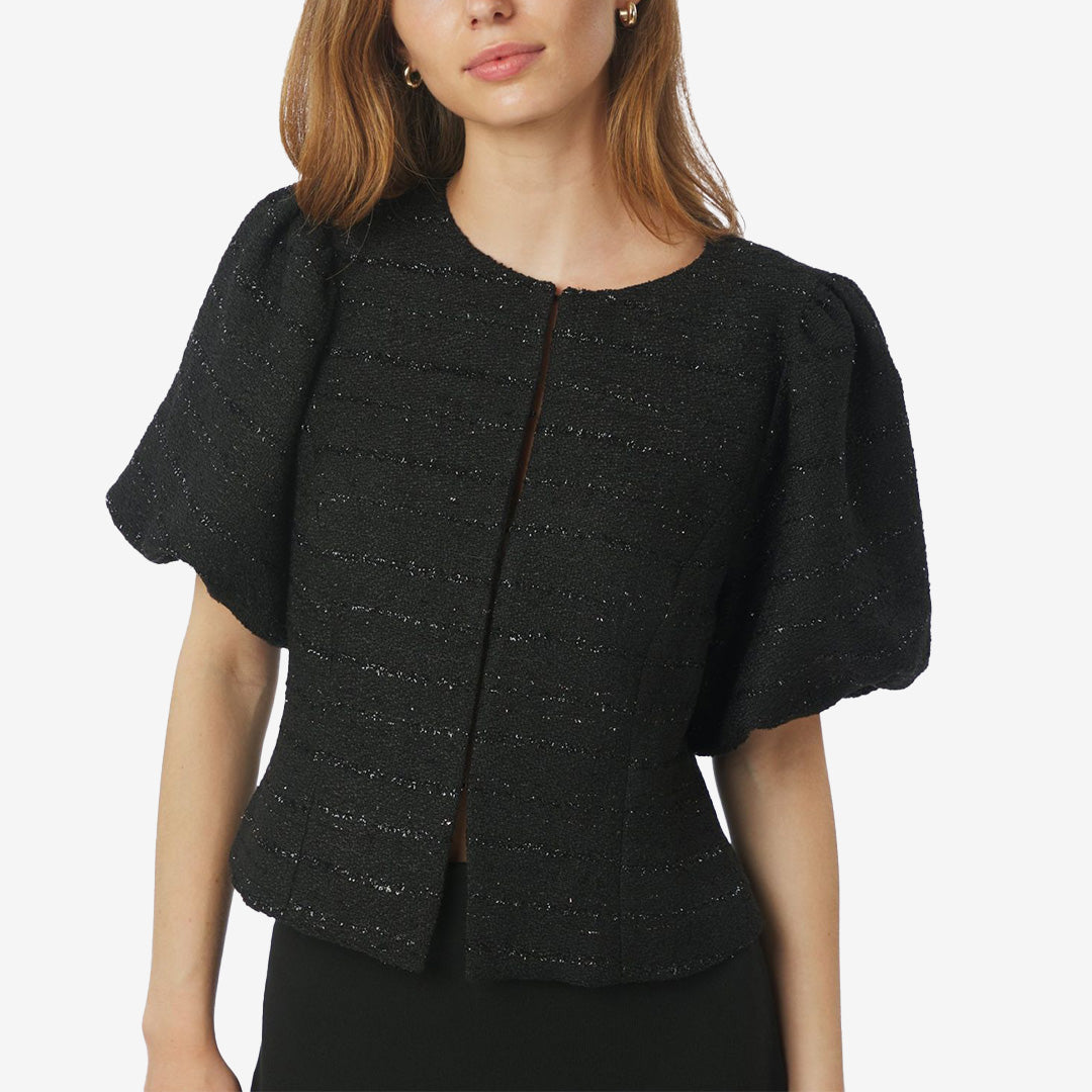 Anela boucle blouse black – svart blus med puffärmar i skimrande bouclékvalitet