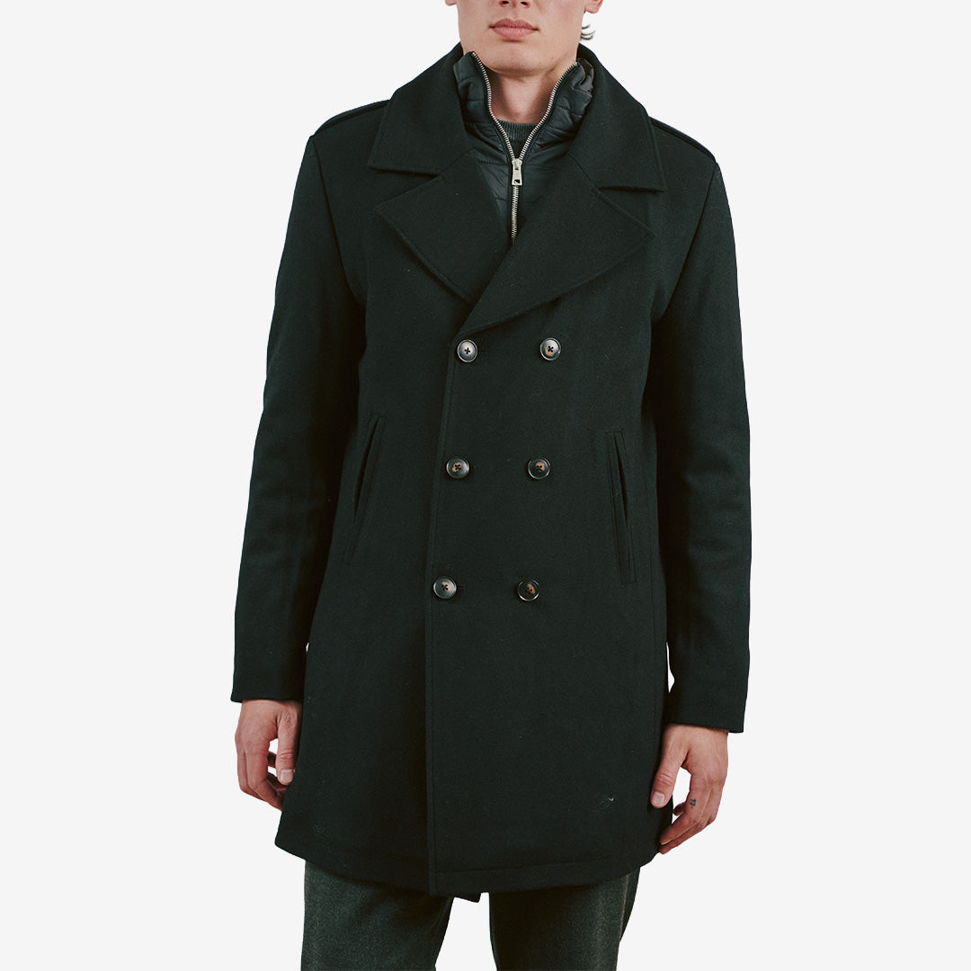 Bruun & Stengade BS Nelson Slim Fit ullrock för herr i Black med dubbelknäppt design, avtagbar nylonväst och klassiska slag.