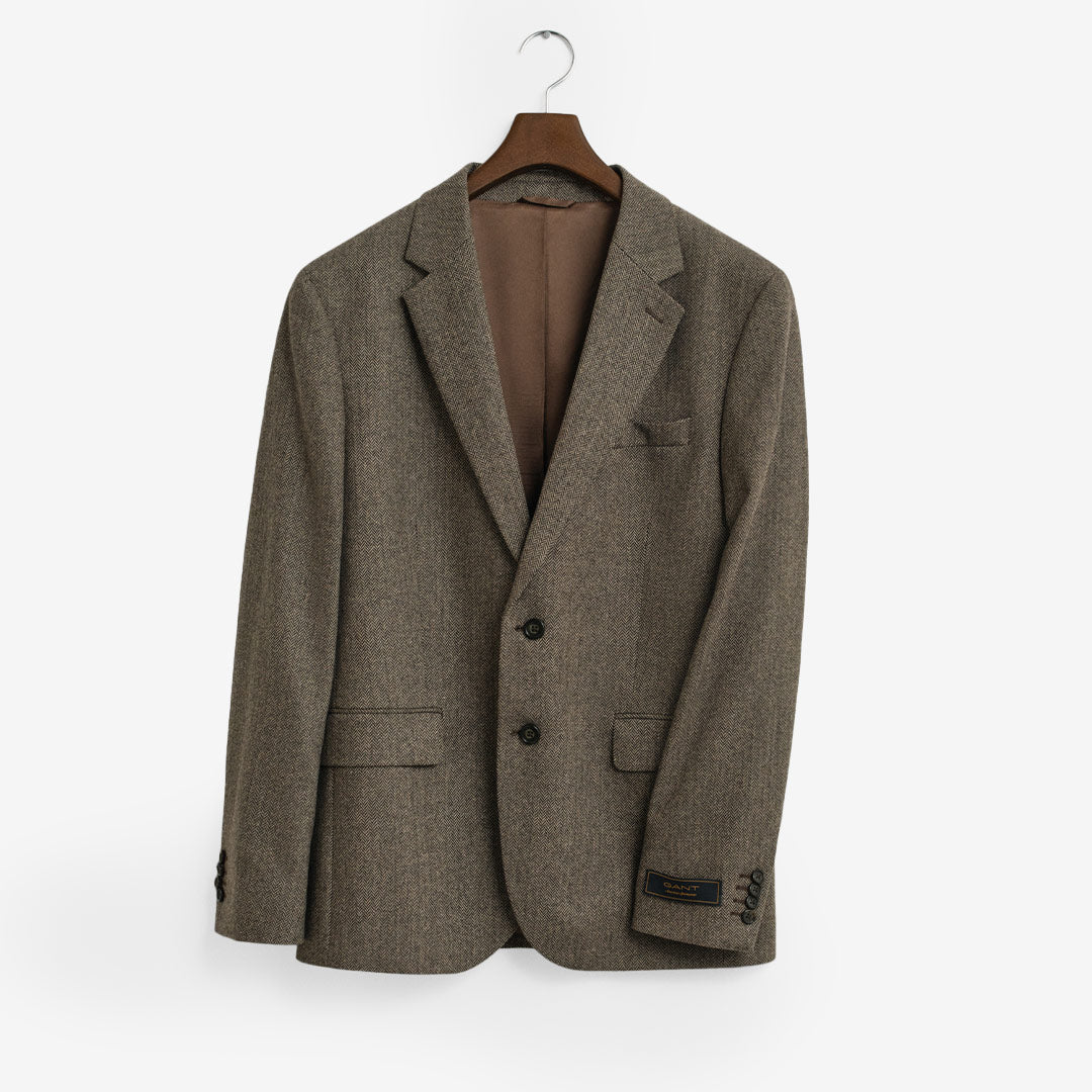 Beige kavaj i ullflanell med fiskbensstruktur och tvåknäppning – herrmodell från GANT

