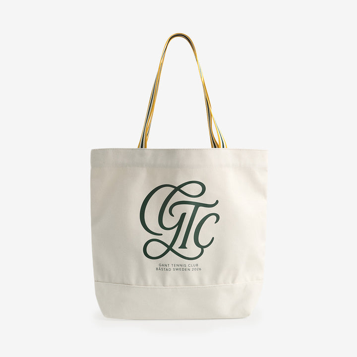 Gant Båstad Tennis Tote Bag i cream med klassisk design och rymligt format i 100% bomull.