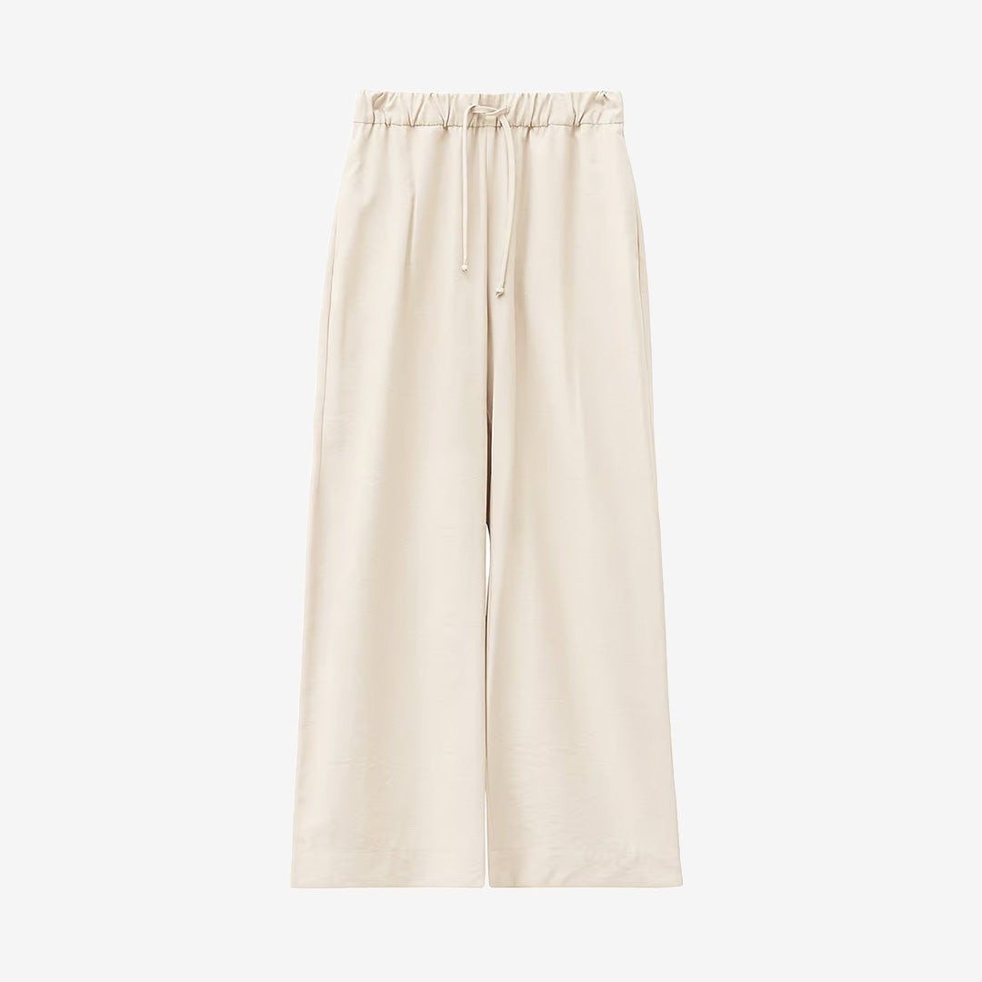 CW261303 Vacant Pants i Ivory Creme från A Part of the Art med vida ben, justerbar midja och avslappnad passform för dam