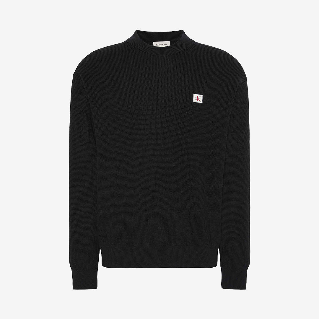 Svart långärmad waffletröja i 100% bomull.