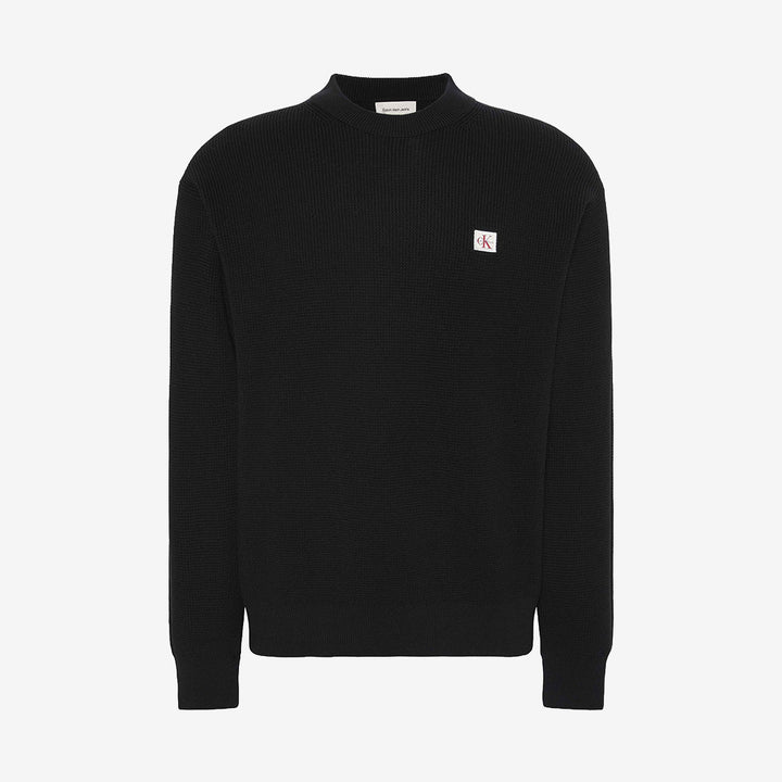 Svart långärmad waffletröja i 100% bomull.