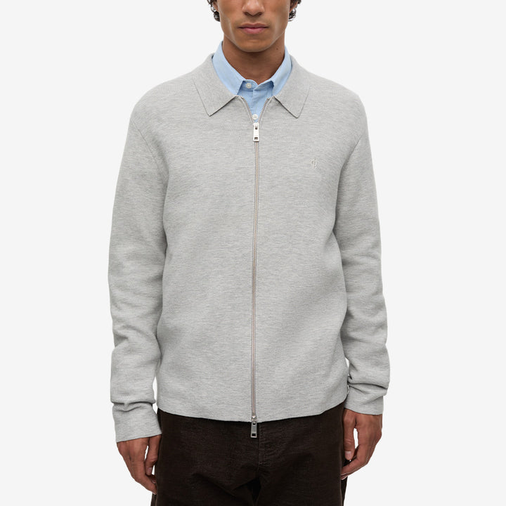 Samsøe Samsøe Samatt Zip Polo Grey Mel., gråmelerad stickad polotröja med polokrage och dragkedja framtill.